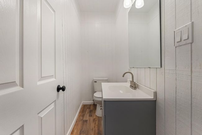 Bathroom with vanity, hardwood / wood-style flooring, and toilet | Image 23