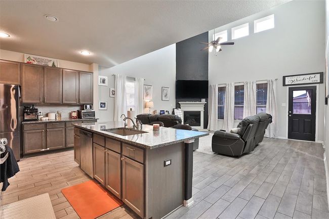 Step into the main living area and enjoy the space it offers. | Image 9