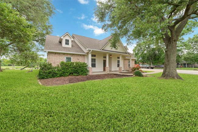 Tucked away on 1.5 serene acres in Manvel, this distinctive property is built for the way you want to live. The flexible floorpan allows between 4 to 6 bedrooms, 2.5 baths, a 2-car garage, in-ground pool, plus a 60'x30' insulated shop. | Image 4