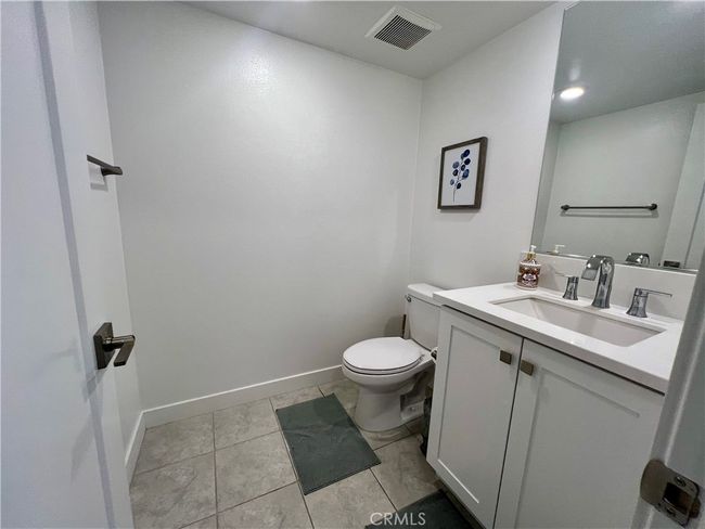 The powder room at the staircase landing between the second and third floors. | Image 14