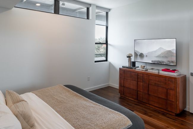 Bedroom featuring baseboards and dark wood-style floors | Image 16