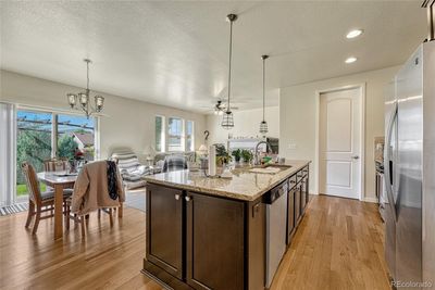 Open floor plan with tons of natural light. Solid hardwood floors and upgraded counters! | Image 3