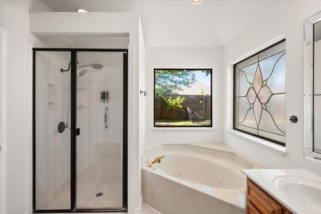 Take a soak in the jetted, garden tub after a long day. There is a separate shower. | Image 32