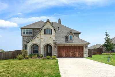 View of front of property with a front lawn and a garage | Image 1