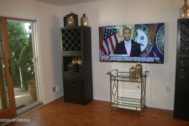 Living room with patio door to large deck | Image 6