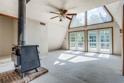 A frame dwelling with wood burning stove. | Image 3