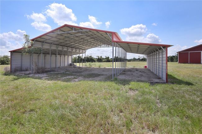 View of parking / parking lot with a detached carport | Image 14
