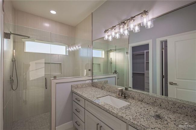 Bathroom featuring vanity, plenty of natural light, and an enclosed shower | Image 8