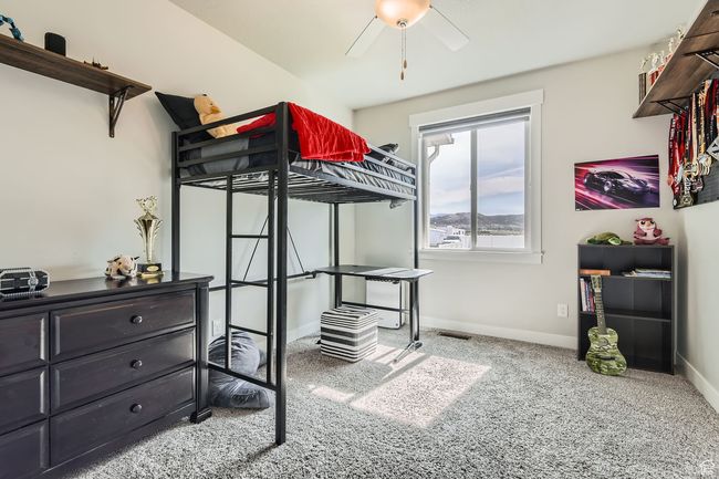 Carpeted bedroom with baseboards and a ceiling fan | Image 17