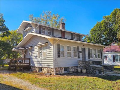 View of front of home with a side deck | Image 2