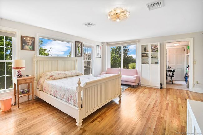 Primary bedroom with hardwood floors | Image 21