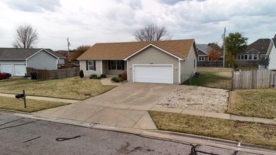 Single story home featuring a garage and a front lawn | Image 3