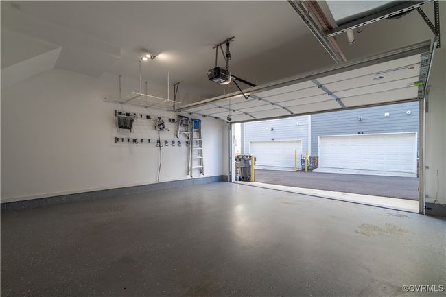 Garage featuring a garage door opener | Image 16