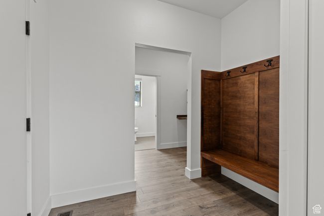 Mudroom with wood finished floors and baseboards | Image 26