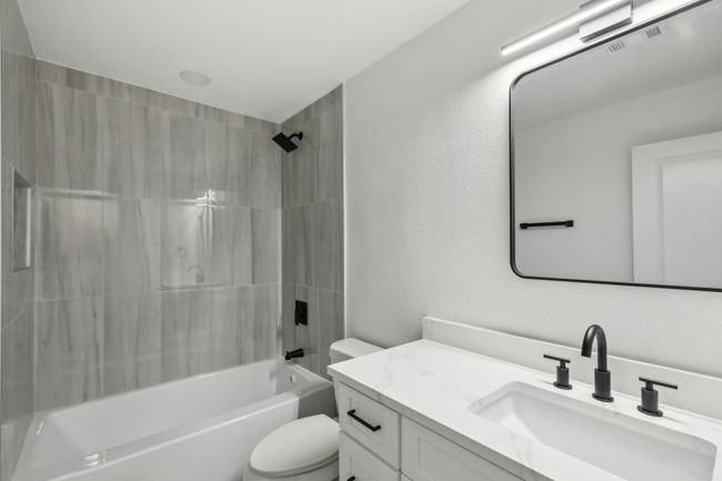 Full bath with visible vents, toilet, shower / bath combination, and vanity | Image 18