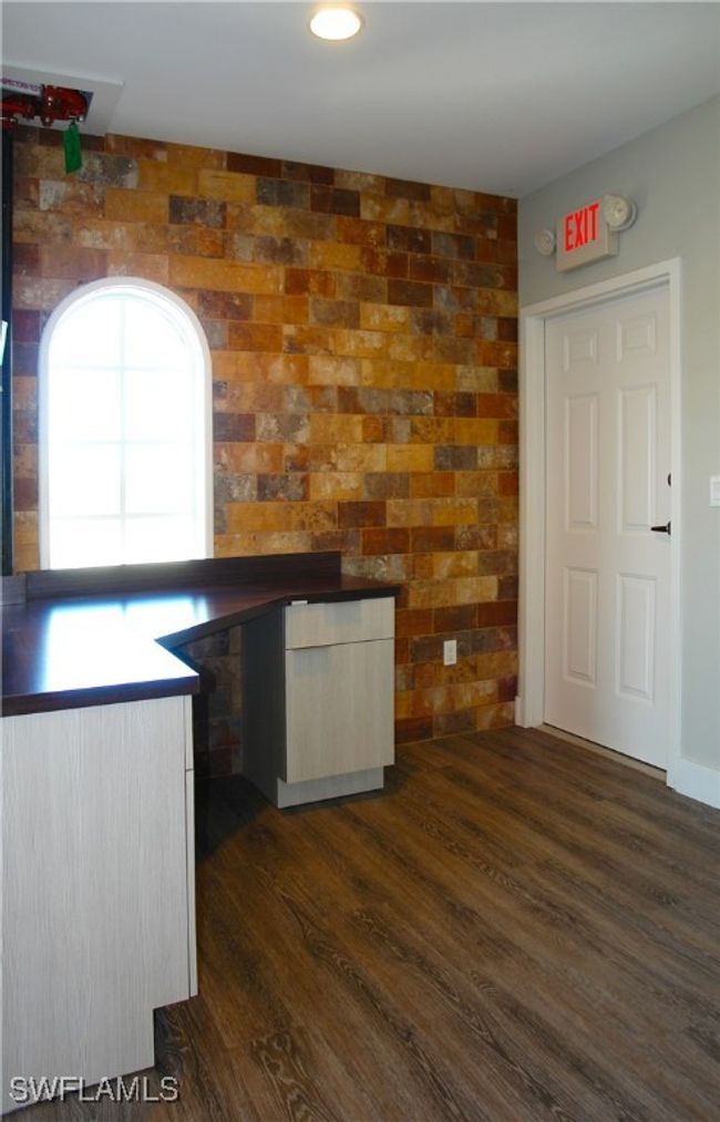 Kitchen with dark wood finished floors | Image 10