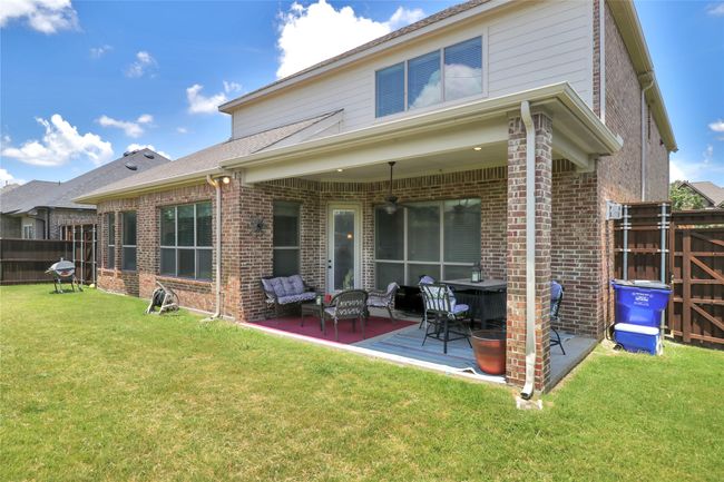 Back yard with covered patio. | Image 23