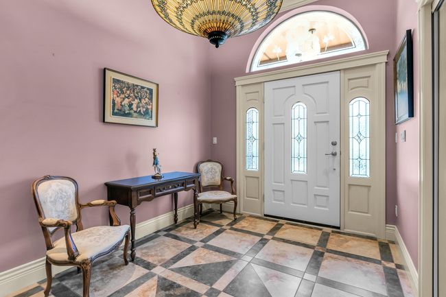 Foyer featuring baseboards, healthy amount of natural light, and inlaid floor details | Image 7