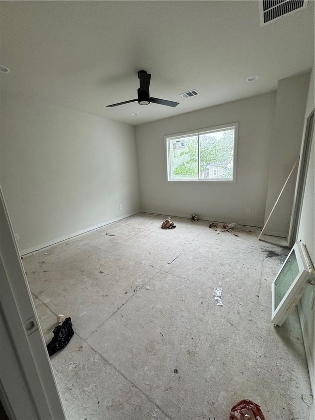 Unfurnished room with a ceiling fan | Image 4