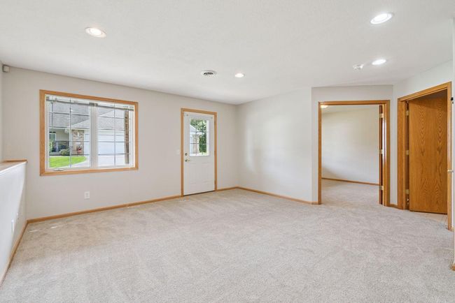 Large (34x13) walkout lower level family room, freshly painted, new carpet, outside leads to back patio, recessed lights. | Image 20