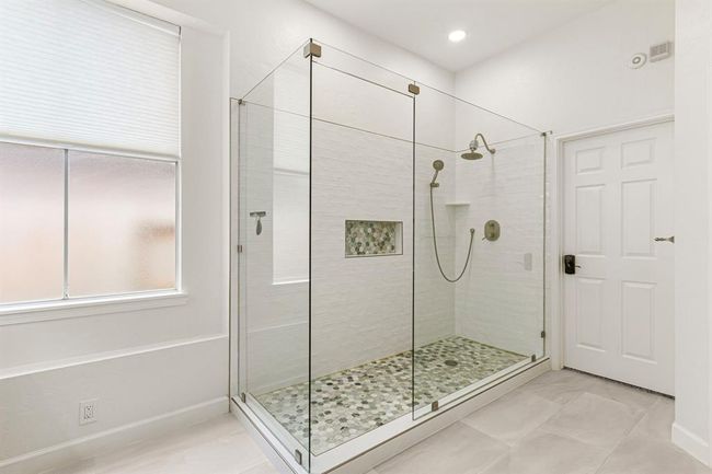 California Closet system allows lots of space for shoes! This closet will keep you organized. A mirror above the shelves bring in natural light. | Image 22