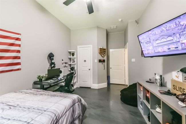 Secondary bedroom has custom epoxy flooring. | Image 24