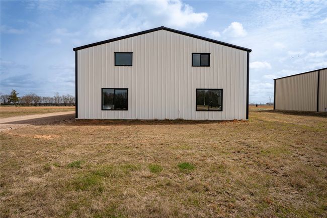 View of pole building with a yard | Image 24