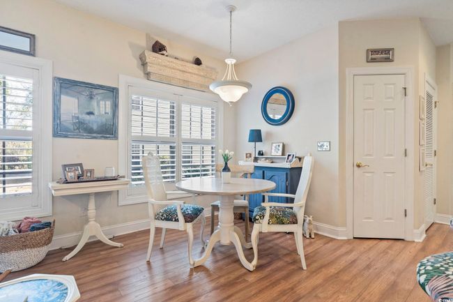 Dining space with baseboards and light wood-style floors | Image 15
