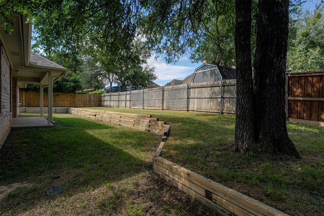 View of fenced backyard | Image 36