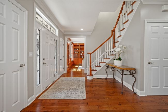 spacious entry area with hardwood floors | Image 4