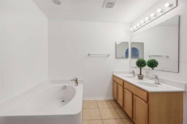 Primary en-suite bath with dual vanity, garden tub and separate shower | Image 16