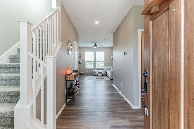 Foyer with stairway, a ceiling fan, dark wood finished floors, and recessed lighting | Image 4