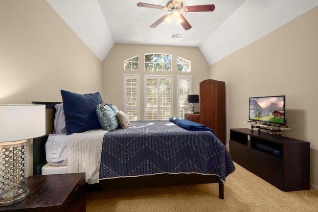 Bedrom 4 - Vaulted ceilings, carpet, shutters, ceiling fan, neutral paint, walk-in closet and accessible to Bath 3 (also a Jack-n-Jill bath). | Image 30
