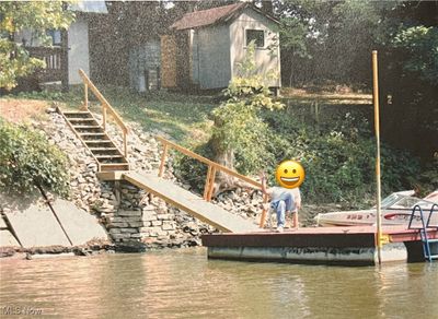 Dock area featuring a water view | Image 2