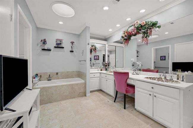 Full bathroom featuring double vanity, a bath, and recessed lighting | Image 27