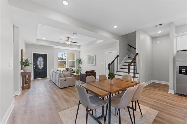 Dining area filled with natural light and open to the kitchen and living room | Image 12