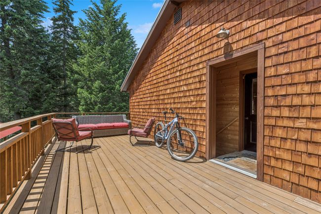 Wooden terrace featuring an outdoor hangout area | Image 46