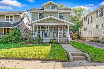 Front facade with a front lawn and covered porch | Image 1