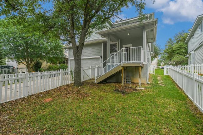 Back of house with a fenced backyard and driveway | Image 26