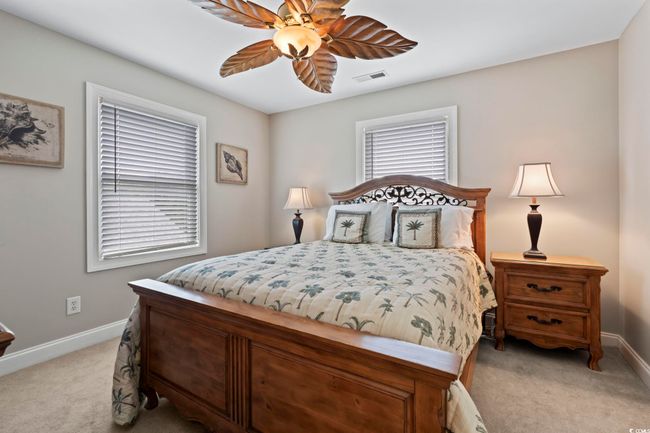 Bedroom featuring carpet floors, baseboards, and a ceiling fan | Image 26