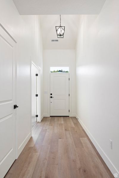 Foyer entrance with light hardwood / wood-style floors | Image 2