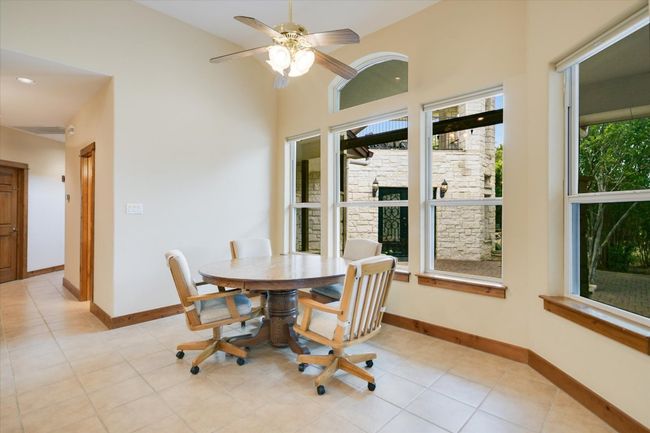 This is a great place to begin and end your day! Overlooking the patio, trees, meadow and planning your escape to the Hobby Room just outside the back door! | Image 10