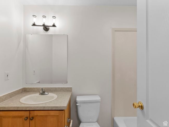 Bathroom with vanity and a bath | Image 15