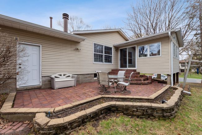 Spacious backyard patio perfect for entertaining friends and family | Image 22