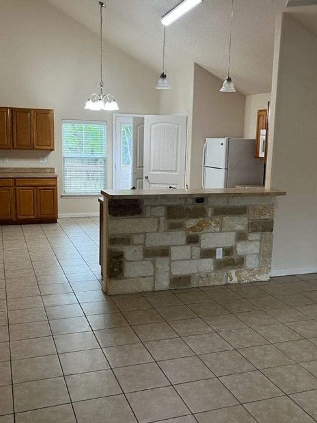 Beautiful high vaulted ceilings with an open floor plan. | Image 4