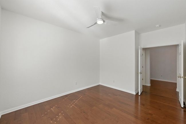 New fan, fresh paint, double doors in this bonus room! | Image 25
