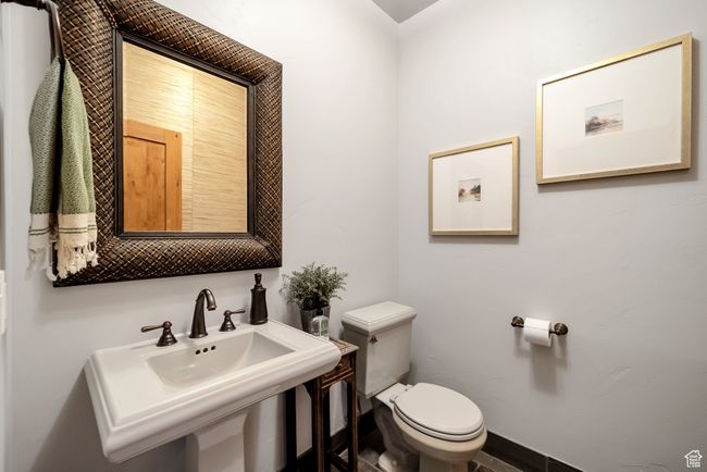 Bathroom with toilet and a sink | Image 37