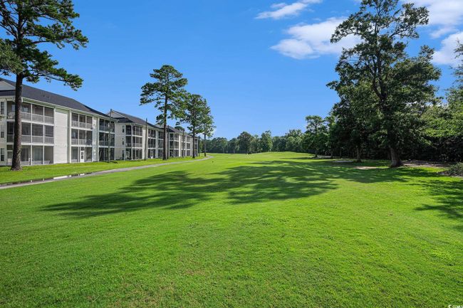 View of home's community with a yard | Image 26