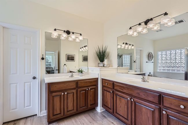 Primary bath with double vanity and plenty of storage. | Image 16