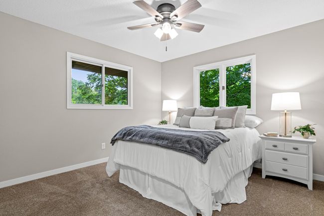 2 bedroom are on the upper level, both have new ceiling fans, new trim and carpet. | Image 10
